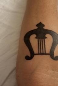 Music tattoo pattern, male arm, music tattoo pattern