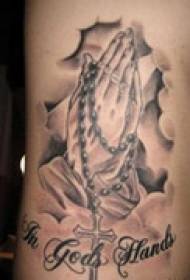Prayer hand arm tattoo