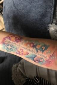 Little cosmic tattoo boy's arm on small cosmic tattoo painted picture
