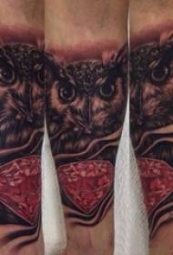 Tattoo owl boy sketching tattoo owl pattern on arm