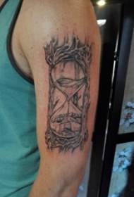 Tattoo arm set boy's arm on black hourglass tattoo picture