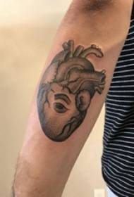 Tattoo black male student arm on eyes and heart tattoo picture