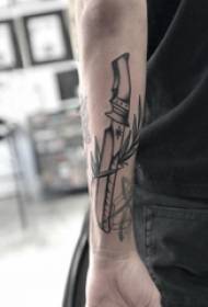 Tattoo black male student arm on plant and dagger tattoo picture