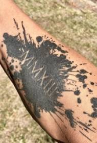 Splash ink style tattoo on male arm