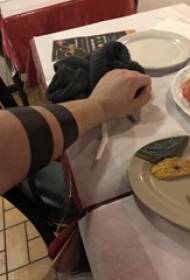 Armband tattoo pattern, minimalist armband tattoo picture on boy's arm