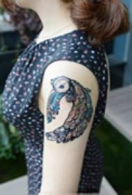 Avant-garde owl arm tattoo