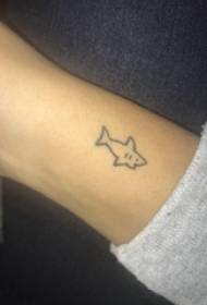 Shark tattoo illustration girl's arm on a small fresh shark tattoo picture