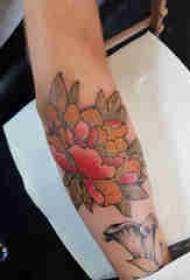 Plant tattoo, boy's arm, colored peony tattoo picture