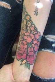 Floral tattoo girl's arm on colored floral tattoo picture