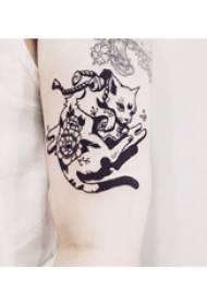 Little animal tattoo girl with black kitten tattoo picture on arm