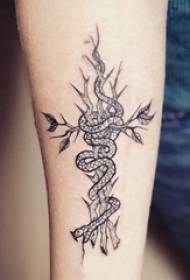 Tattoo snake demon boy's arm on dry branches and snake tattoo pictures