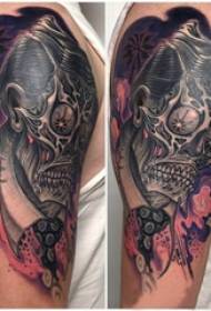 skull tattoo, painted picture of tattoo on the boy's arm