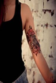 Fine art arm tattoo