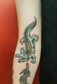 Cartoon crocodile tattoo girl colored crocodile tattoo picture on arm