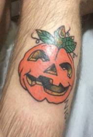 Tattoo cartoon school boy with colored pumpkin tattoo picture on arm