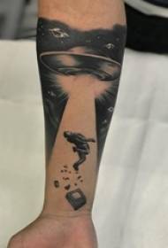 Arm tattoo picture boy character on arm and flying saucer tattoo picture