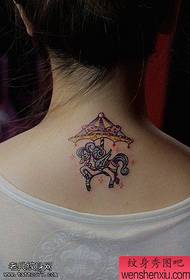 Woman back colored carousel tattoos