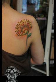 Woman back sunflower tattoo work