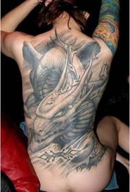 Meedchen zréck dominéiert Draach-geformt Monster Tattoo Muster Bild