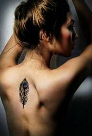 Beautiful back feather tattoo on female back