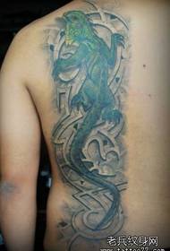 Man back a colored lizard tattoo pattern