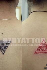 Good looking totem triangle tattoo on the back