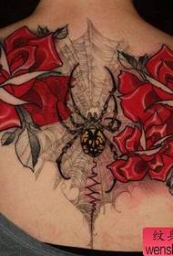 Woman back rose spider spider tattoo work by tattoo