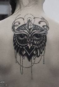 Woman back owl tattoo work by tattoo