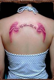 chica hermosa de moda tatuaje de alas de bo aspecto foto