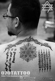 A back totem Sanskrit tattoo pattern is provided by the tattoo show bar