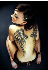 Female back beautiful looking black and white wings tattoo pictures
