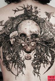a woman's back skull wings tattoo pattern