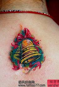 Beautiful bell tattoo on the back