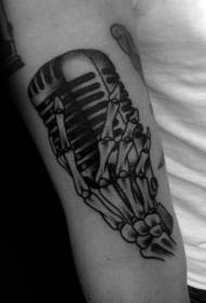 Arm black microphone with skull tattoo pattern