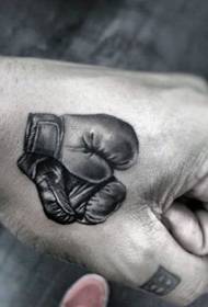 Håndgrå realistisk tatovering med boksehandsker i lille størrelse