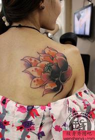 Girl's back only beautiful looking colorful lotus tattoo pattern