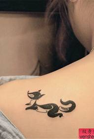 Woman back fox tattoo work