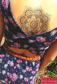 Woman back flower tattoo pattern