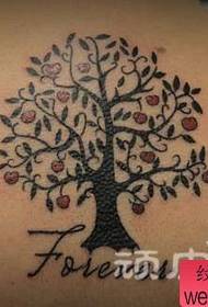 Girl with a totem tree tattoo on the back