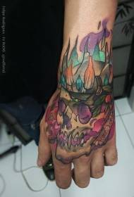 Hand back watercolor style king skull flame tattoo pattern