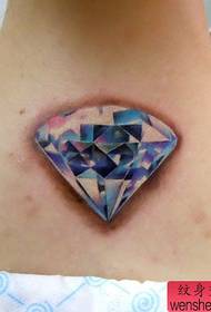 Beautiful colored diamond tattoo pattern on the back of the girl