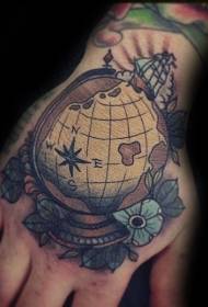 Hand junk style colored small globe tattoo picture
