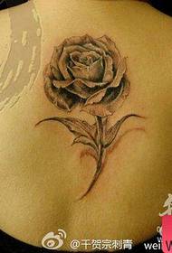 Beautiful dark gray rose tattoo pattern on the back of girls