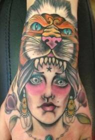 Hand back colored tribal women with lion skin helmet tattoo