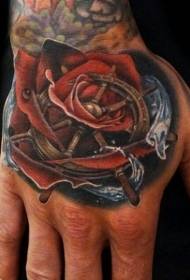 Hand rygg färgad ros och hav ratt tatuering bild