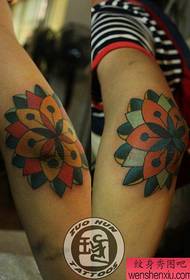 Arm elbow totem flower tattoo pattern