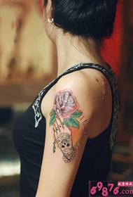 Blooming rose tattoo picture in hand