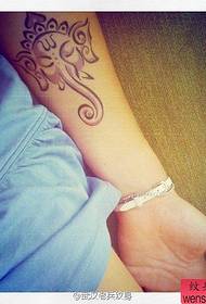 An arm like a god tattoo