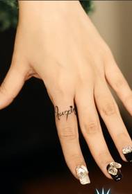 English tattoo picture on girl jade finger