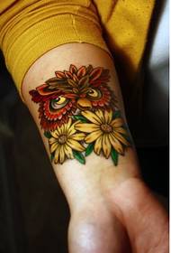 Beautiful looking owl flower tattoo pattern picture at wrist